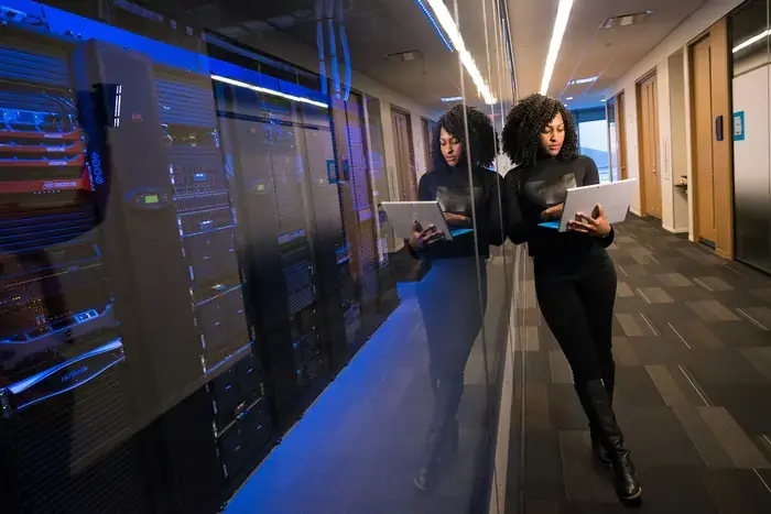 person-on-laptop-in-server-room (2)